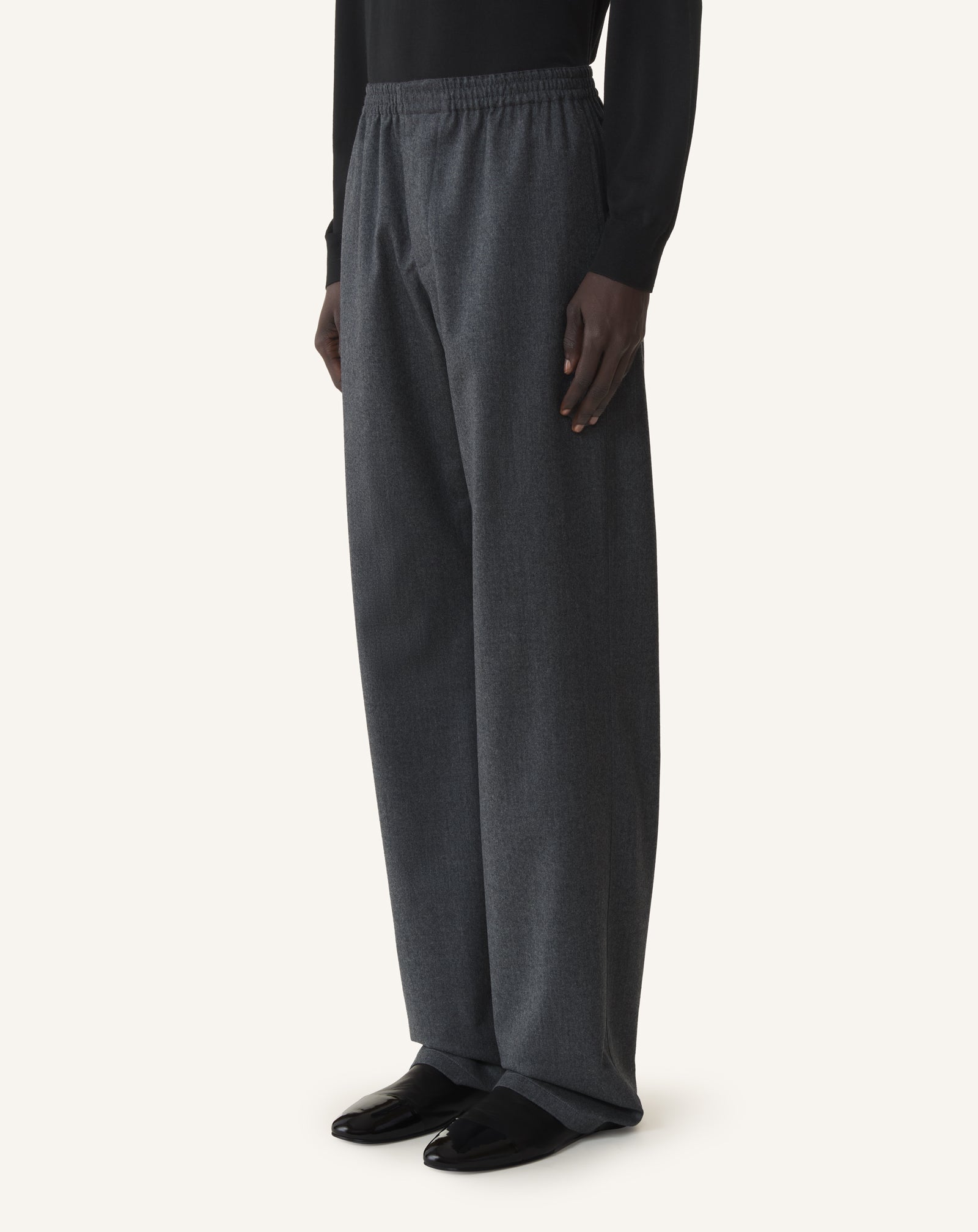 BLACK FLUID WOOL FLANNEL TROUSERS